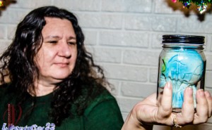 Wendi holding a Skull in a Jar.